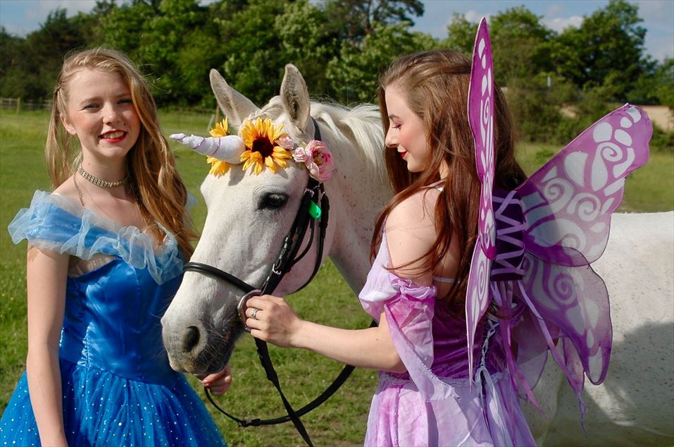 Enchanted Party hosts, and Daisy the unicorn