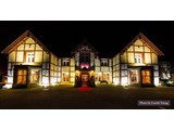 An exterior of the Lyons Nant Hall Hotel by night