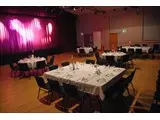 The auditorium set for a formal dinner dance