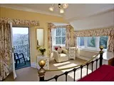 A front facing seaview bedroom with balcony